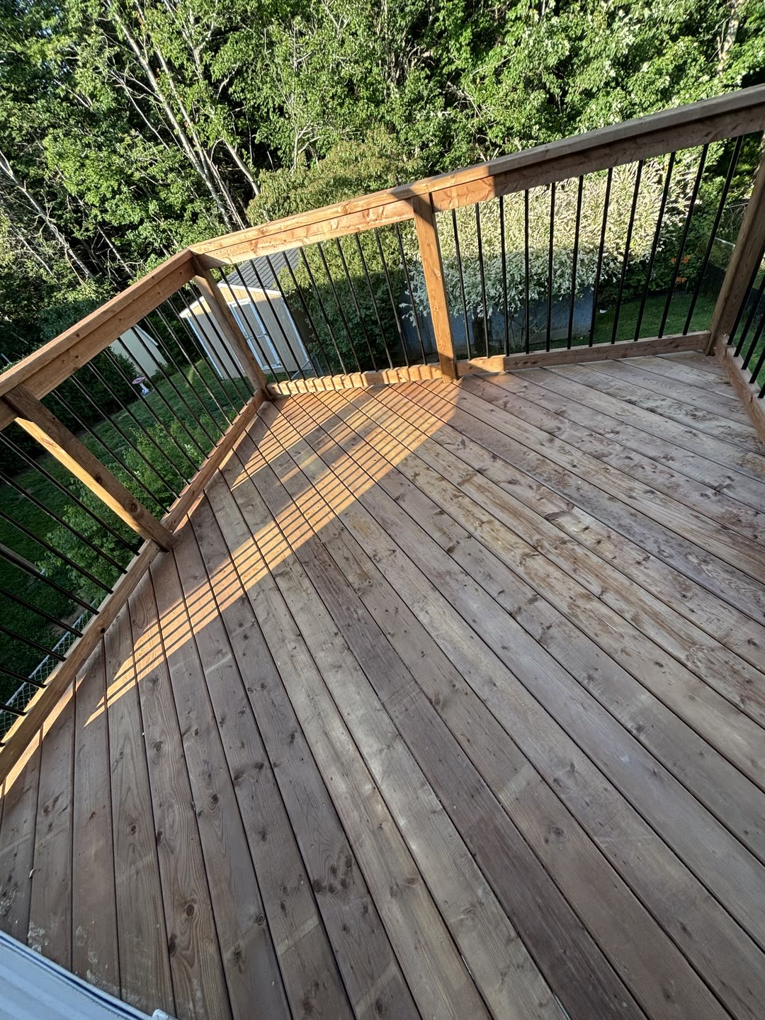 Wood deck with railing at golden hour